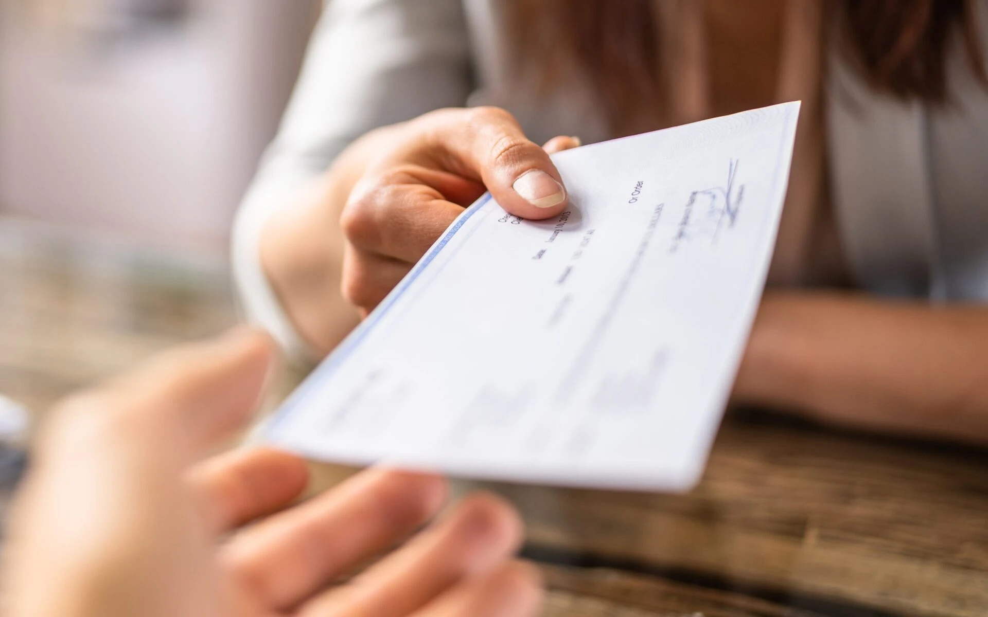 Settlement compensation check representing successful car accident injury recovery for California crash victims receiving fair compensation for medical bills, lost wages, and pain and suffering